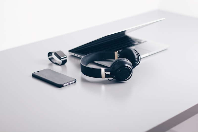 Modern eco-friendly tech gadgets flat lay including laptop and accessories